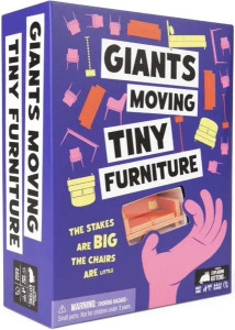 A board game titled “Giants Moving Tiny Furniture” in black font with white text boxes behind the letters.  The cover features a dark blue background, with several copies of common household furniture floating across it.  Below the title is a clear, plastic window that reveals a small couch.  The window is has a pink, cartoon hand pinching around it, as if to pick up the couch.  To the left of this is a quote that reads “The Stakes are Big and the Chairs are Little” in yellow font.