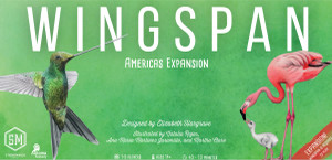 A board game titled "Wingspan: Americas Expansion" in large, white letters across the top of the primarily green cover.  The art features watercolor paintings of a blue and green hummingbird, as well as two flamingoes: one a parent, the other its chick.