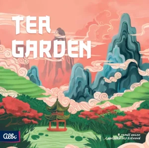 A board game titled “Tea Garden” in large, white font at the top of the primarily pink cover.  The artwork depicts a stylized illustration of the Yunnan region of China, a hilly, green place with vertical stones, swirling mist, and terraced mountainsides.