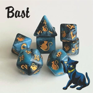 A set of blue and black swirled polyhedral dice with gold numerals and cats on one side instead of numbers.  In the bottom right corner is a black and blue, cartoon cat with golden eye makeup reminiscent of ancient Egyptian artwork and a golden collar.