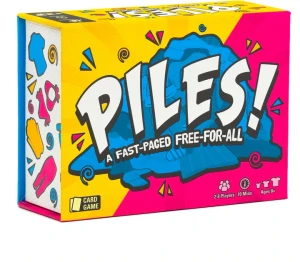 A board game titled “Piles!” in large, white font across the center of the cover.  Behind the title is a drawing of a pile of laundry colored entirely in shades of blue, and behind that is a half yellow, half hot pink background.