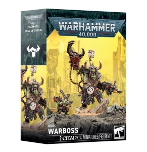 A Warhammer 40K product titled “Orks: Warboss” in white font at the bottom of the cover.  The art features a very large, green humanoid clad in leather armor with metal embellishments.  He has a horned helmet that obscures the upper half of his face and holds up one arm with a metal pinching claw, while the other arm is tipped with a gun.  Beside him is a much smaller green humanoid holding up a much smaller gun.