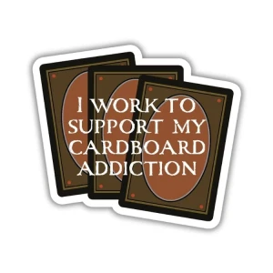 A vinyl sticker featuring a spread of the backs of trading cards drawn to resemble Magic: The Gathering singles.  In front of them is white text that reads, "I work to support my cardboard addiction."