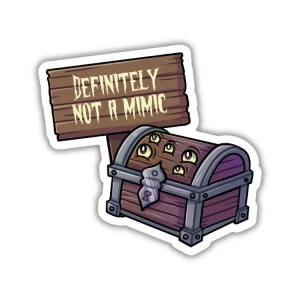 A vinyl sticker featuring a wooden treasure chest with five eyes looking up at a wooden sign that reads "definitely not a mimic" in drippy, white font.
