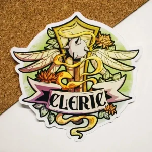 A vinyl sticker featuring a vibrant illustration of a spiked mace surrounded by golden magic, feathered wings, lotus flowers, and a golden plaque.  Below is a scroll that reads, "Cleric," in large, black font.