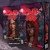 A board game titled "Final Girl: Once Upon a Full Moon" in bold red slasher font.  Below the title is a girl with dark skin in a red hood.  Her face sports a haunted expression and a myriad of  scratches.  Behind her are trees, a river with a bridge, and a cottage with low lights shining through the windows.  The whole scene is bathed in the light of a full moon hanging in a blood red sky. A board game titled "Final Girl: Once Upon a Full Moon" in bold red slasher font.  Below the title is a girl with dark skin in a red hood.  Her face sports a haunted expression and a myriad of  scratches.  Behind her are trees, a river with a bridge, and a cottage with low lights shining through the windows.  The whole scene is bathed in the light of a full moon hanging in a blood red sky.