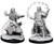 Two unpainted Male Human Wizard miniatures on a white background. The miniature on the left is holding a focus and casting a sell while the one on the right is using both hands to cast a spell.