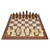 A walnut chess board with pieces placed on their starting positions.