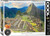 The image is a puzzle box with a photograph of Machu Picchu in Peru. The photograph covers the front of the box, showcasing the ancient Incan city surrounded by lush green mountains. Stone ruins are visible, with terraces and buildings against a backdrop of steep, verdant peaks under a partly cloudy sky. A llama, with a reddish-brown coat, stands in the foreground among the stone structures. The title, "Machu Picchu, Peru" is printed along the bottom side. On the right hand edge, the company logo reads "EUROGRAPHICS PUZZLES" in white text on a black background and the number ‘1000’ after it indicates the puzzle piece count. In the bottom left, there is a picture of a camera lens with the words "HDR Photography - Scenic Landscape" printed on the inside rim of the lens.