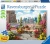 A puzzle with the words “Ravensburger Puzzle” at the top and the number ‘500’ along the left side of the white bordered cover.  Below is an image of the finished puzzle, which features a rooftop garden in a city.  The roof is scattered with terracotta pots filled with flowers, bushes, and small, carefully trimmed trees.  A bench sits beside the ledge with more puts on one side of it, with the other kept clear for sitting.