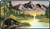 A playmat with black, stitched edges with a print of Bob Ross' painting titled "Mountain Retreat" which features a distant mountain with a river winding towards the foreground, which is lined with green grasses and trees.  A small log cabin sits beside the river. A playmat with black, stitched edges with a print of Bob Ross' painting titled "Mountain Retreat" which features a distant mountain with a river winding towards the foreground, which is lined with green grasses and trees.  A small log cabin sits beside the river.