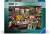 A puzzle with the words “Ravensburger Puzzle” at the top and the number ‘1000’ along the left side of the blue-green bordered cover.  Below is an image of the finished puzzle, which features a small workbench filled with vases and flowers of various species.  There's also paper, twine, floral foam, and more arranging supplies strewn across the surface.  A small, white puppy sits on the chair before it.