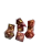 A set of 8 polyhedral dice, with 7 of the standard varying side ranges and 1 compass die with sides representing the 4 cardinal directions.  Each features opaque, red and white swirled resin and yellow numerals.