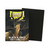 A TCG card sleeve titled "Dragon Shield Matte Dual: Black & Gold" across the top and bottom of the cover of the box.  The art features a black and gold, spikey dragon with many branching horns and a flat, snake-like face.  Beside the box is a display of the black card sleeve.