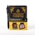 A gift set that includes a small notebook with a black cover and yellow text that reads "A Dungeon Anarchist's Cookbook," two page clips, one with a pair of boxers and one featuring a fist and text that reads, "you will not break me," and a black pen.