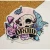 A vinyl sticker featuring a carnivorous animal's skull that has a moon engraved on its forehead.  Around it are large rose heads, small berries, long leaves, and mushrooms.  Below is a scroll that reads, "Druid," in large, black font.