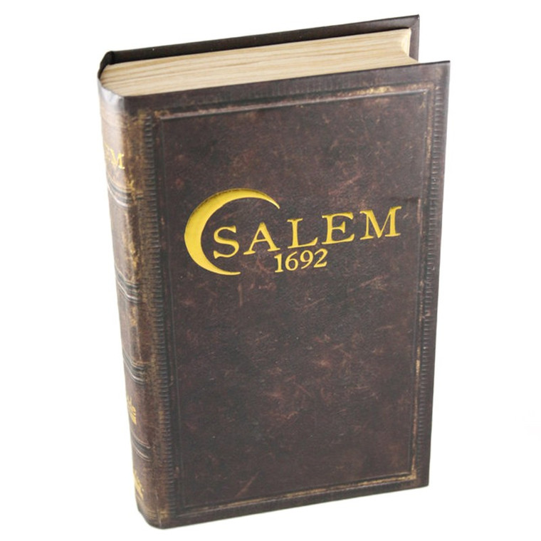Board game titled "Salem 1692" in gold font.  The game box is designed to resemble a brown, leather book.