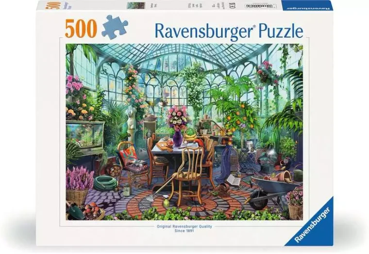 A puzzle with the words “Ravensburger Puzzle” at the top and the number ‘500’ along the left side of the white bordered cover.  Below is an image of the finished puzzle, which features a photo-realistic digital painting of the interior of a glass greenhouse.  The flooring is made up of cobblestone with a swirl of brings in the center, and atop it is an array of tables and eclectic items all overflowing with plant life.