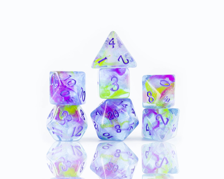 A complete set of Sirius Dice with swirling watercolor streaks throughout the dice.