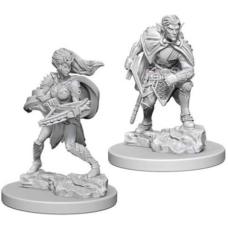 Two unpainted Drow miniatures on a white background.