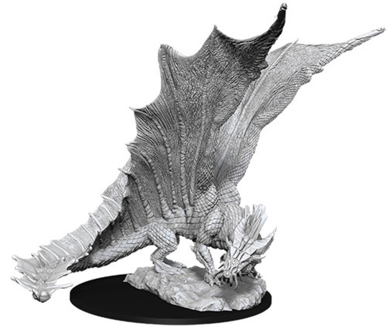 An unpainted Young Gold Dragon with wings spread out on a white background.