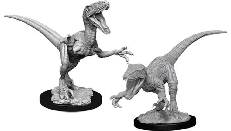 Two unpainted Raptor miniatures on a white background.