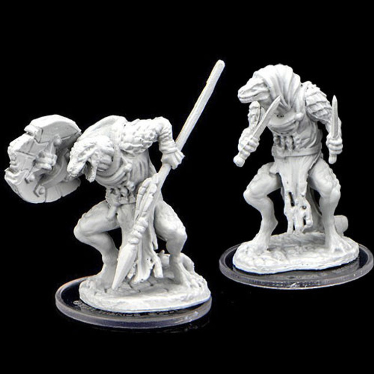An unpainted Javelineer and Assassin miniature on a black background.