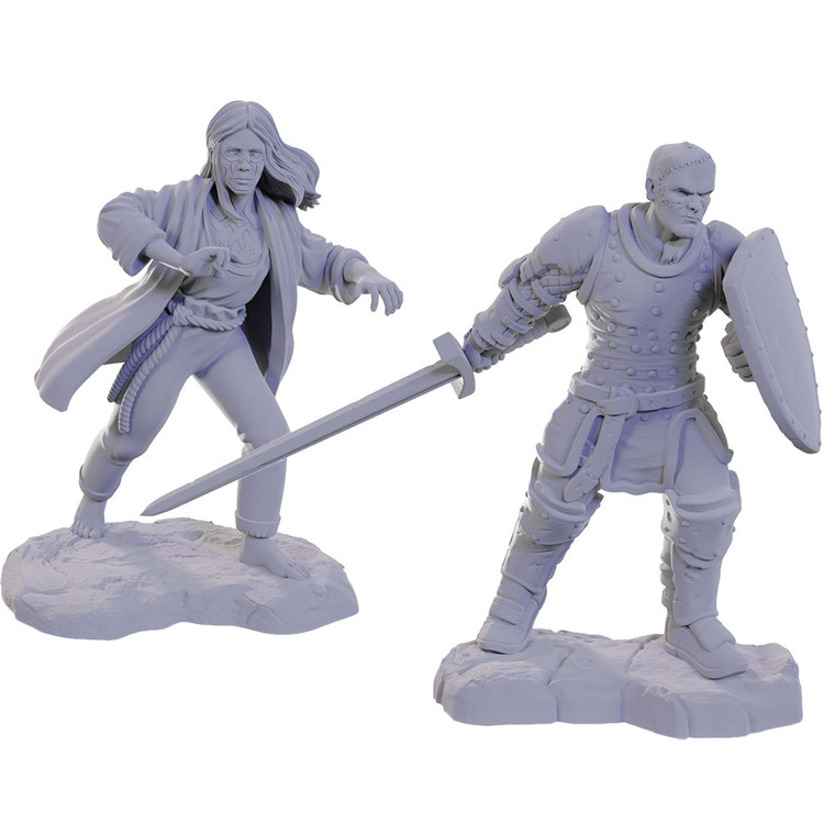 An unpainted Reborn Paladin and Reborn Warlock miniature on a white background. The miniature on the left is a female warlock and the miniature on the right is a male paladin.