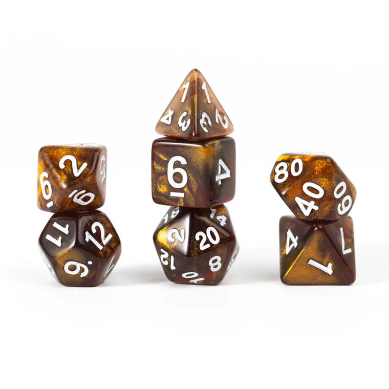 A set of 7 Sirius dice that mimic the look of topaz with silver inking in the numbers