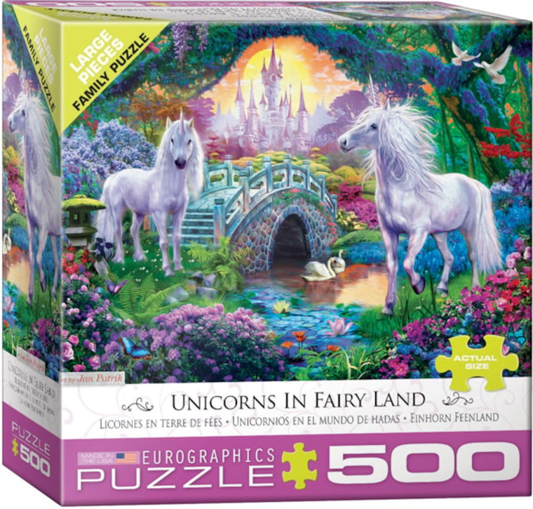 A puzzle titled, “Unicorns in Fairy Land,” at the bottom in several different languages, with the artist's name right above it.  The company logo “Eurographics Puzzle” is in large font along the bottom, and number ‘500’ right next to it in the cover’s green border.  In the center is what the completed puzzle looks like: two white horses with horns in a vibrantly colored forest with a castle surrounded in towers off in the distance.
