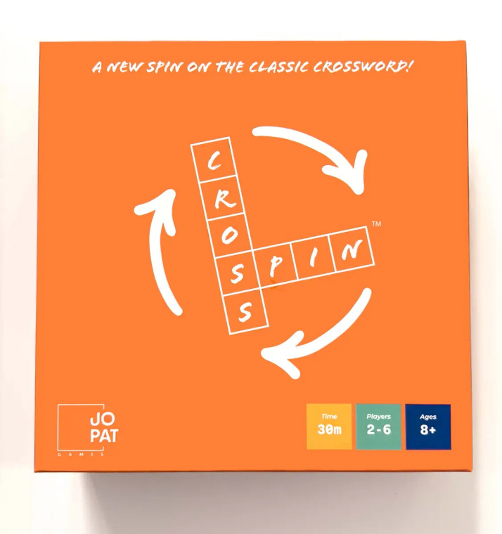 A board game titled “Cross Spin” within a crossword puzzle cross section set of squares.  The rest of the cover is a rather bold shade of orange, and three simple arrows circle around the central title.