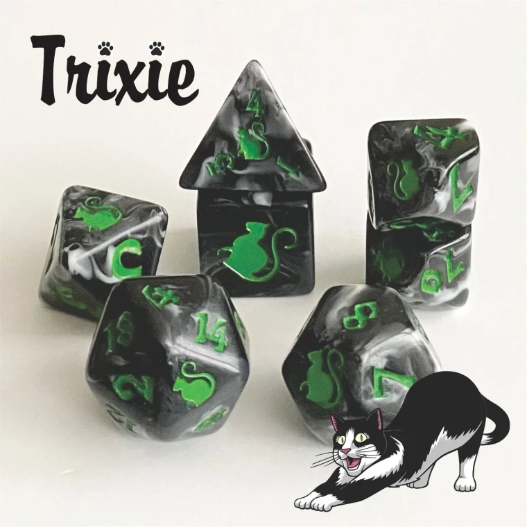 A set of 7 swirled black and grey, opaque polyhedral dice with green numerals and cats on one side instead of numbers.  In the bottom right corner is a cartoon of a stretching black and white cat whose mouth is open in a wide grin .