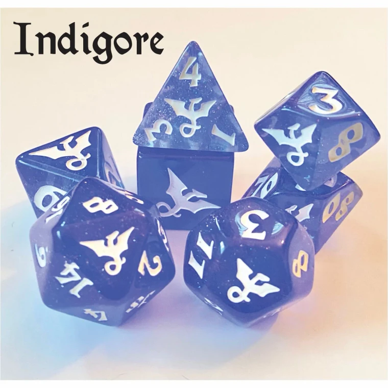 A set of 7 polyhedral dice with glittery, light blue, translucent resin and white numerals.  On one side of each, there is little dragon icon with its wings outstretched and a curled tail.