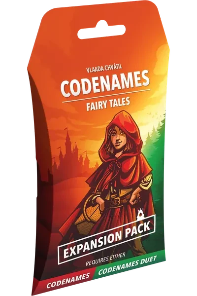 A board game titled "Codenames: Fairy Tales Expansion Pack" across the top and bottom of the cover.  The art features a green and red illustration of a girl wearing a red, hooded cape and carrying a picnic basket.  She stands in front of a dense tree-line, and an ominous castle looms on a distant hill.
