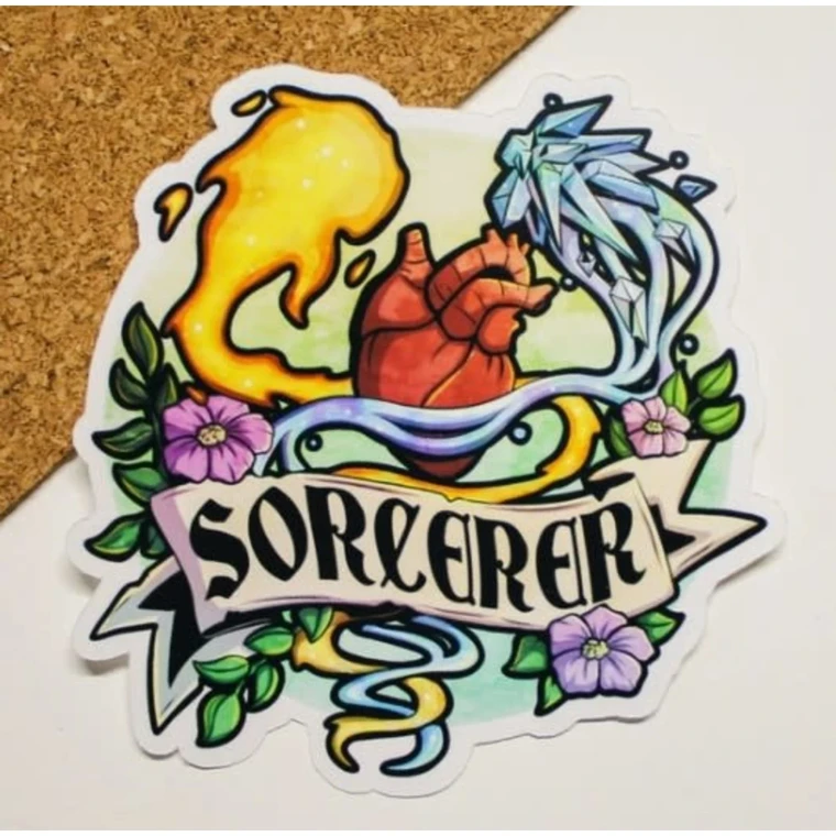 A vinyl sticker featuring a vibrant illustration of an anatomical human heart flanked by a swirl of ice magic on one side and fire on the other.  The image is surrounded by green vines and purple flowers. A scroll across the bottom reads , "Sorcerer," in large, black font.