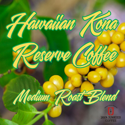 Java Junkies Hawaiian Kona Reserve Coffee. Yellow coffee cherries still on the tree with a tropical background and green leaves.