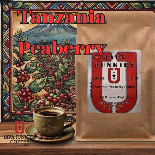 Bag of Java Junkies Tanzania Peaberry coffee next to a mug on a wooden table with a Mount Kilimanjaro map in the background.