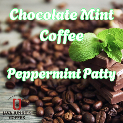 Java Junkies Chocolate Mint Coffee. Coffee beans piled up near some chocolate bars that are stacked up with mint leaves sitting on the chocolate. 