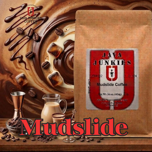 Java Junkies Mudslide Coffee. Redish brown coffee cup full of coffee with creamer on a brown wooden table.