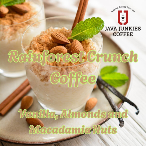 Rainforest Crunch Coffee. Nuts top a milk creamy glass of coffee surrounded by vanilla bean and cinnamon.