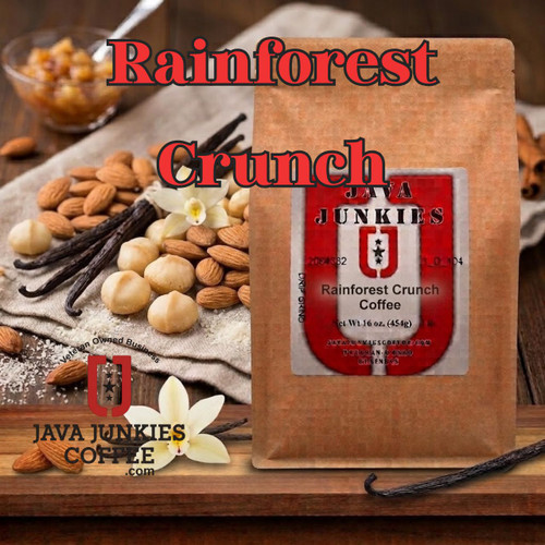 Java Junkies Rainforest Crunch Coffee. Nuts on a cloth with some vanilla and coffee surrounded by vanilla bean and cinnamon.