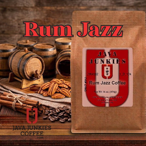 Java Junkies Rum Jazz Coffee. Barrels of rum sitting next to some nuts and vanilla behind a bag of coffee on the shelf.