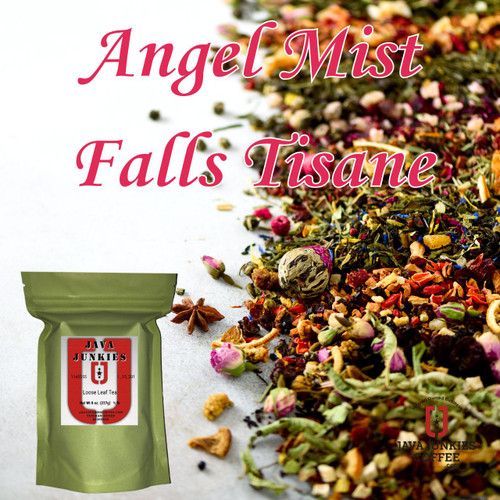 A colorful assortment of loose-leaf herbal tea ingredients including dried rosebuds, star anise, and flower buds scattered across a white surface next to a green loose leaf tea selection.