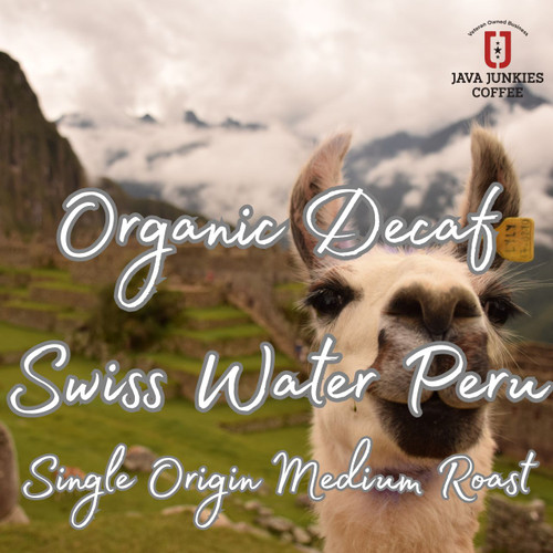 Java Junkies Organic Decaf Swiss Water Peru Coffee. A Lama looking back at the camera while overlooking the Peruvian Mountains.