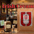 Java Junkies Irish Cream Coffee. A bag of fresh roasted coffee sitting on a bar in an Irish Pub next to a bottle of Irish Cream Liqueur. 