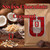 Java Junkies Swiss Chocolate Coffee. Coconuts and Chocolate sitting behind a bag of coffee on a shelf.
