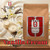 Java Junkies Vanilla Cream Coffee. Delicious Vanilla cream coffee bag sitting next to vanilla beans with a vanilla flower.
