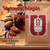Java Junkies Vermont Maple Pecan Coffee.  Clear bottle of maple syrup sitting next to some pecans with leaves sitting on some dark wood.