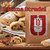 Java Junkies Vienna Strudel Coffee. Raspberry strudel with icing on a white plate next to a bag of coffee on a shelf.