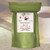 Java Junkies Rooibos Red Bush African Tea label centered over a background featuring a steaming white mug of dark red herbal tea and a sliced lemon.